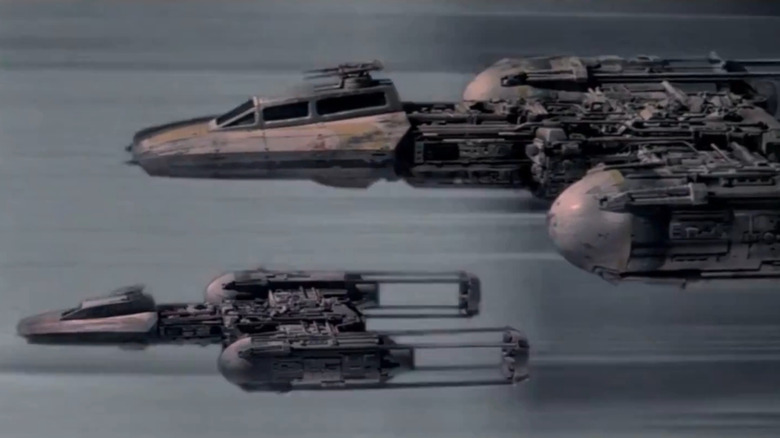 Two "Star Wars" Y-Wing starfighters flying in the Death Star run.