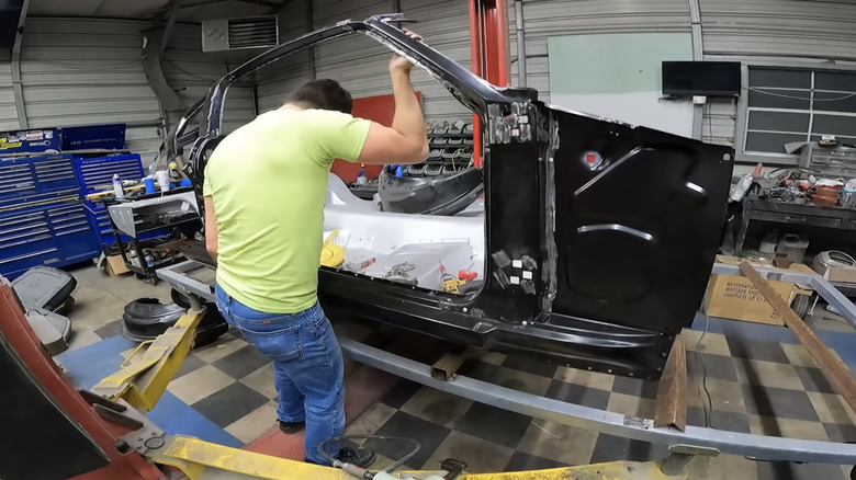 The host attaching the car's side structure to the floor pan