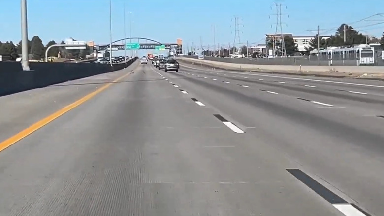 Contrast pavement markings on a concrete highway in Aurora, Colorado.