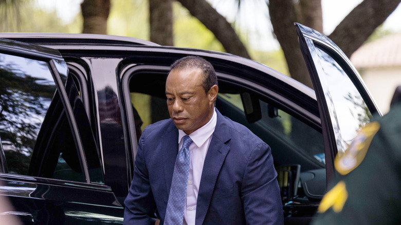 Tiger Woods outside the courthouse in front of an SUV on Sept 2.