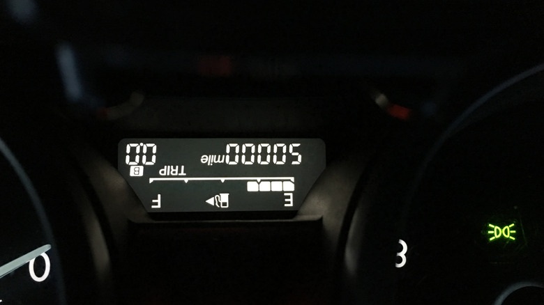 A digital display of mileage from an odometer showing 50,000 miles