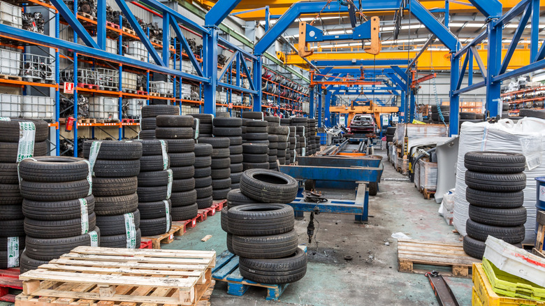 Cars being stored in a warehouse for recycling