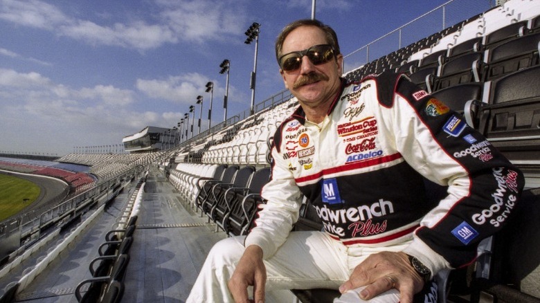 A photo Dale Earnhardt Sr sitting in the stands at a race track