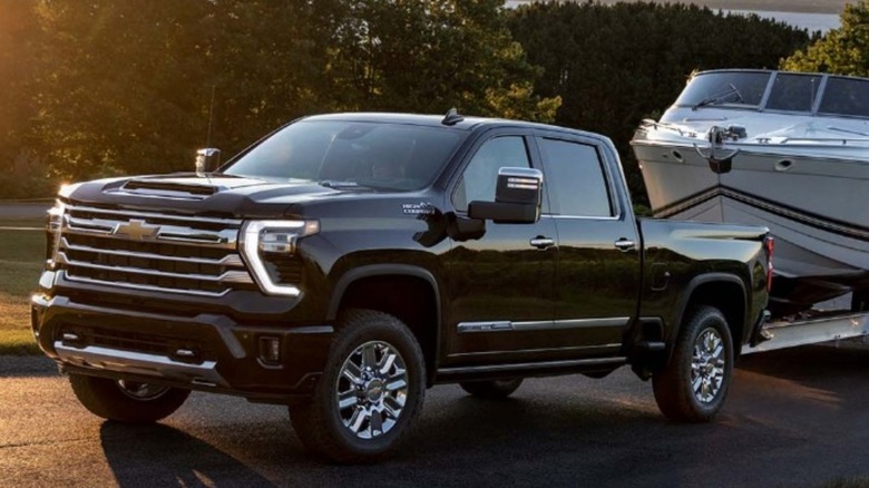 The heavy-duty Chevrolet Silverado towing a boat.