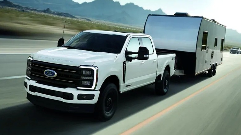 The Ford Super Duty towing a camper trailer.
