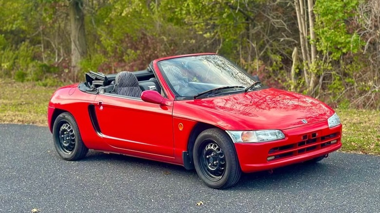 A red Honda Beat convertible