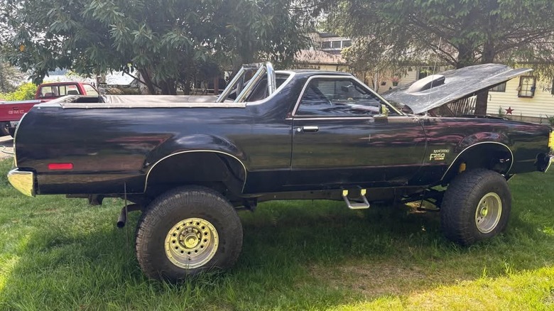 A jacked up Ford Ranchero ute