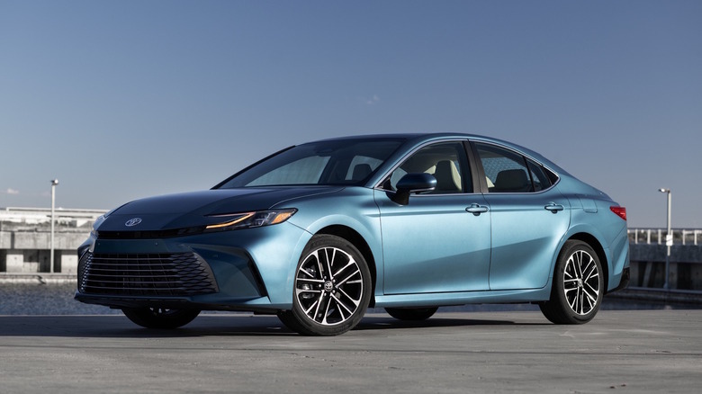 A blue 2026 Toyota Camry in a parking lot.