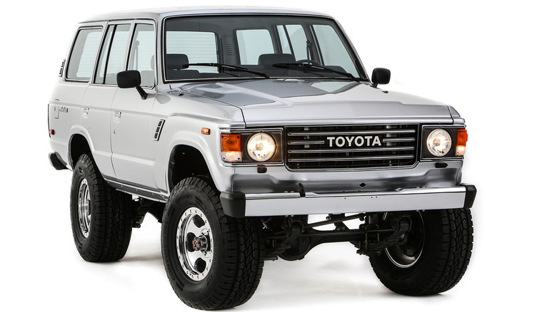 front three-quarters shot of the silver Turbo Trail Cruiser SEMA build shot in a studio in front of a white background