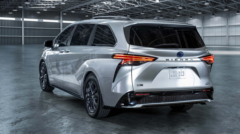Rear 3/4 view of a silver 2023 Toyota Sienna.