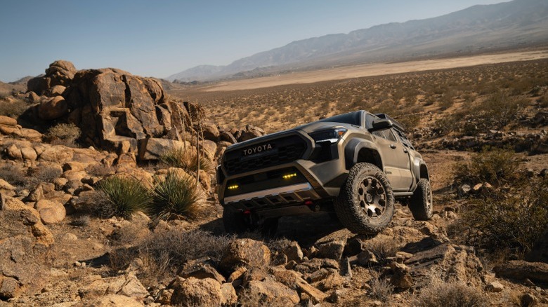 2025 Toyota Trailhunter crawling over rocks