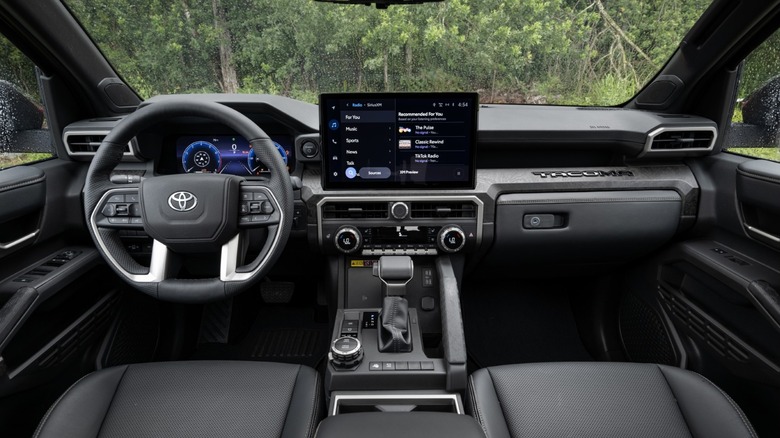 The dashboard and front cabin layout of a 2026 Toyota Tacoma Limited.