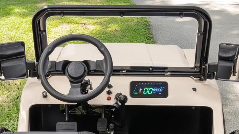 An interior view of a Massimo Mini Truck and its digital display.