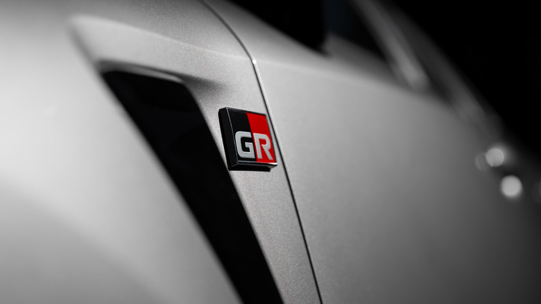 A close-up image of a gray 2026 Toyota GR Corolla's fender badge