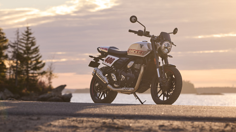 Triumph Tracker 400 at sunset near the water