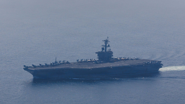 EDITOR'S NOTE: This Handout image was provided by a third-party organization and may not adhere to Getty Images' editorial policy.) In this handout photo obtained from the U.S. Defence Department, Nimitz-class aircraft carrier USS Abraham Lincoln (CVN 72) and Arleigh Burke-class guided-missile destroyer USS Frank E. Petersen Jr. (DDG 121) sail in the Arabian Sea, Feb. 6, 2026. According to the U.S. government, the Abraham Lincoln Carrier Strike Group is deployed to the U.S. 5th Fleet area of operations to support maritime security and stability in the Middle East. The deployment to the region comes as the U.S. continues to put pressure on Iran over its nuclear program and its response to recent anti-government protests. (Handout photo by Mass Communication Specialist 1st Class Jesse Monford/U.S. Navy via Getty Images)