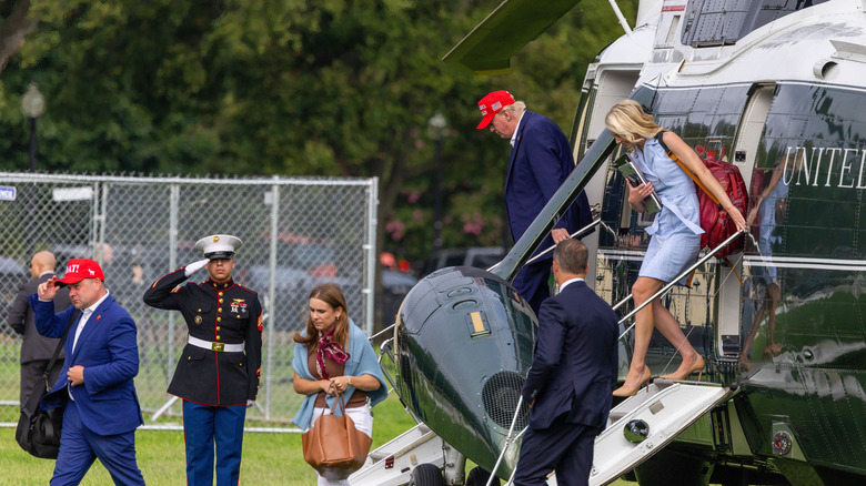 Trump and his home health aid descend from Air Force 1 helicopter