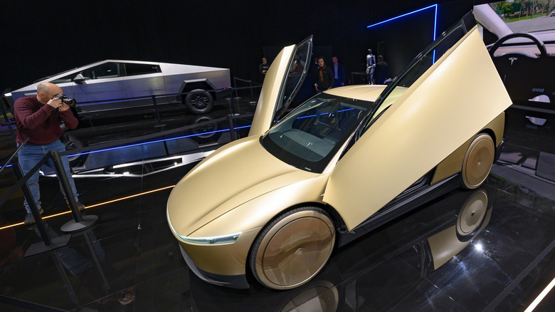 Tesla Cybercab or Robotaxi two-passenger battery-electric self-driving car and Tesla Cybertruck battery electric pickup truck on display at the 2025 Autosalon on January 10, 2025 in Brussels, Belgium.