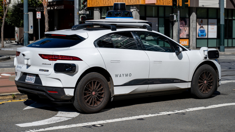 Waymo self driving car waiting at a city intersection, San Francisco, California, March 18, 2025.