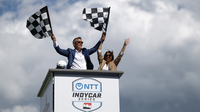 WASHINGTON, DC - AUGUST 23: (L-R) U.S. Secretary of Transportation Sean Duffy waves the checkered flag with his wife Rachel Campos-Duffy at the NTT INDYCAR Series on August 23, 2026 in Washington, DC. U.S. President Donald Trump established the Freedom 250 Grand Prix weekend as part of the yearlong celebration of America's 250th anniversary. (Photo by Finn Gomez/Getty Images)