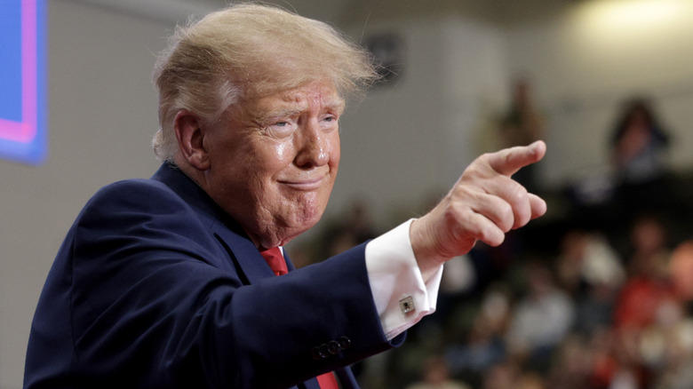 Donald Trump points a finger.