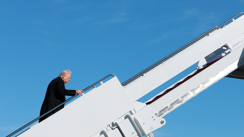 JOINT BASE ANDREWS, MARYLAND - JANUARY 13: U.S. President Donald Trump prepares to board Air Force One on January 13, 2026 at Joint Base Andrews, Maryland. Trump is traveling to Michigan where he will participate in a tour of the Ford River Rouge complex and later give remarks to the Detroit Economic Club.