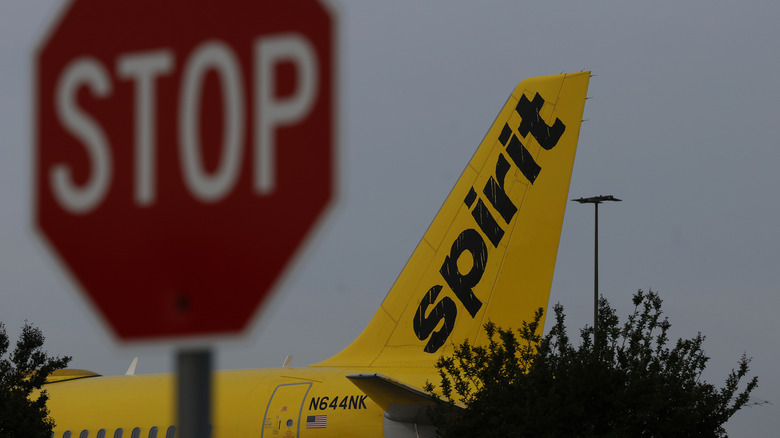 A Spirit Airlines plane sits parked at Hollywood Burbank Airport on April 16, 2026 in Burbank, California.