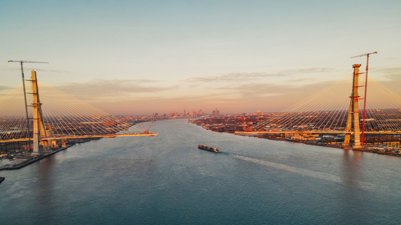 the gordie howe bridge under construction during sunset