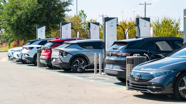 Austin , Texas , USA - September 5th 2023: Many Electric Cars charging at Electrify America Charging Stations full of Electric Cars
