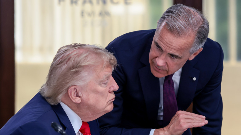 U.S. President Donald Trump speaks with Canadian Prime Minister Mark Carney at a working lunch with leaders of G7 and the Middle East, on June 16, 2026 in Evian-les-Bains, France.