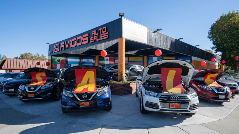 SALE sign is seen at the San Jose Amigos Auto Sales, a used car dealer in San Jose, California.