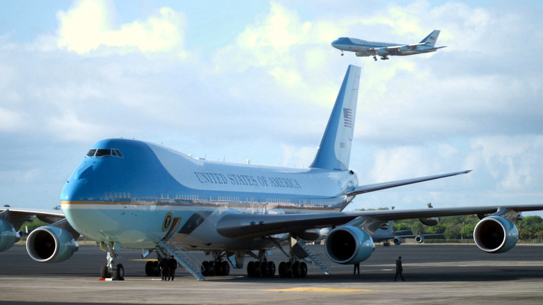 Air Force One lands at Hickam Air Force (AFB) with US President George W. Bush on board for his first visit to Hawaii while holding office. On the ground, the second Boeing VC-25A.