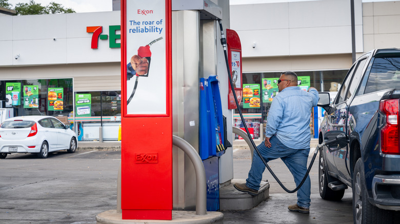 A person pumps gas at an Exxon gas station on July 10, 2026 in Austin, Texas
