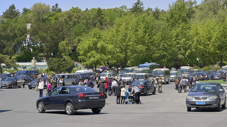 North Korean residents attempting to park in a car parking area in Pyongyang
