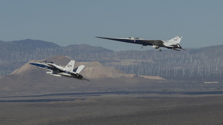 An F-15 chasing the X-59 prototype for NASA's Quesst mission
