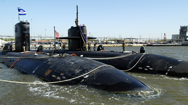 The USS Newport News and the USS Boise docked together