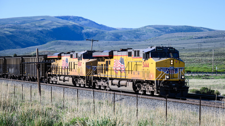Helper, UT, USA - June 11, 2024; Union Pacific loaded coal train climbing to Soldier Summit in rural Utah  by: Ian Dewar Photography