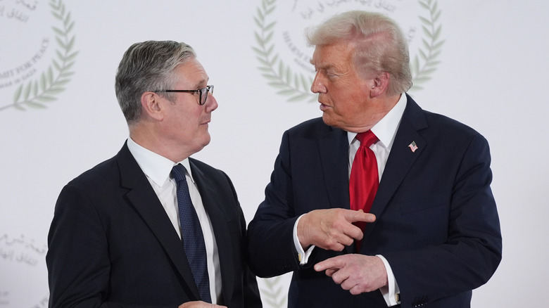U.S. President Donald Trump greets Britain's Prime Minister Keir Starmer during a summit to support ending the more than two-year Israel-Hamas war on October 13, 2025 in Sharm El-Sheikh, Egypt.