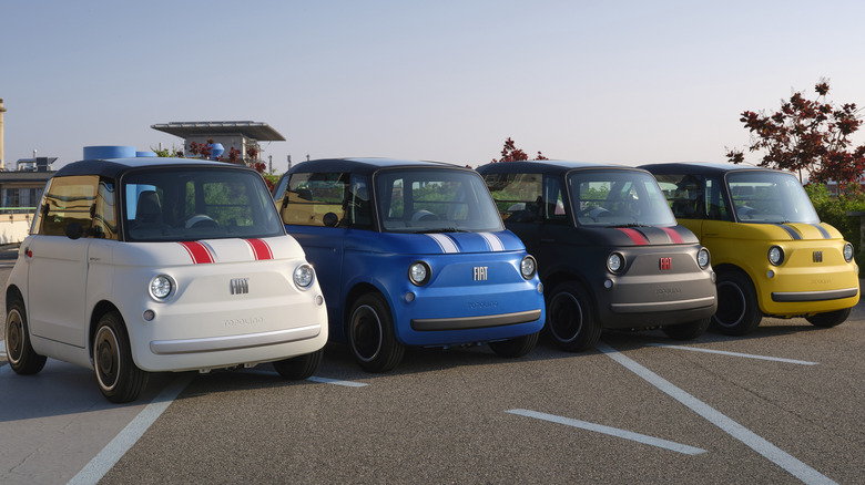 A wide shot of all the different colors of Topolino Sports parked next to eachother