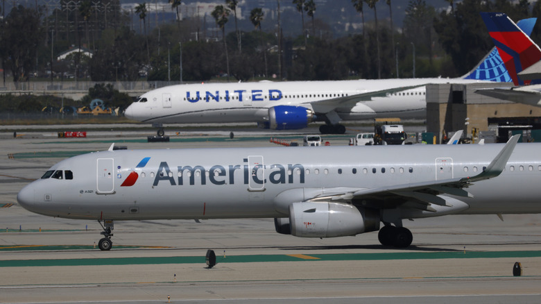 American Airlines and United Airlines airplanes taxi at Los Angeles International Airport on March 7, 2026 in Los Angeles, California.