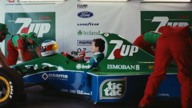 A screenshot of "The Kaiser" official trailer showing mechanics pushing the Jordan 191 into a garage