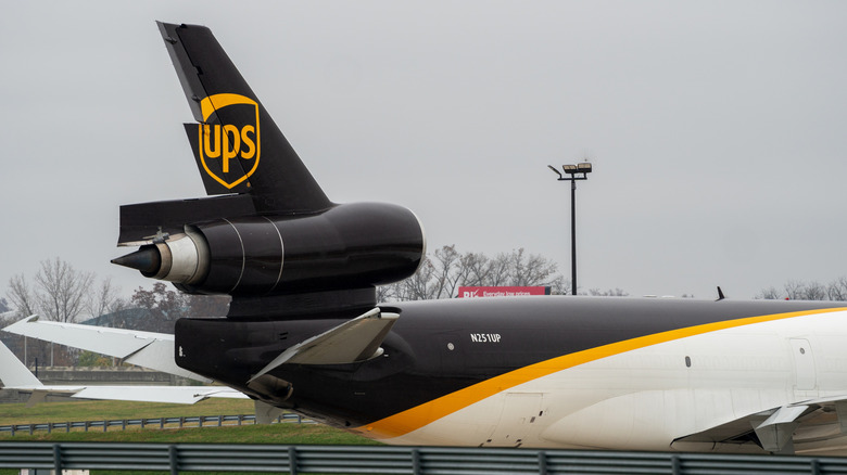 Close-up of a McDonnell Douglas MD-11 tail with the UPS logo and markings