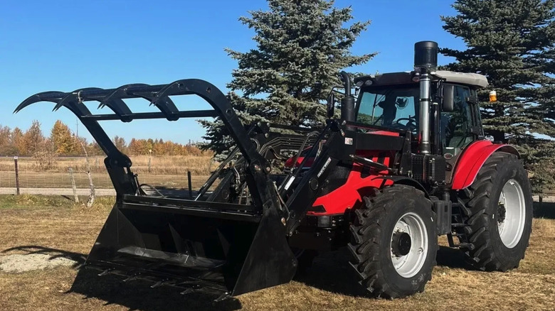 Ursa AG's AG 180 model with a fork and bucket attachment at the front.