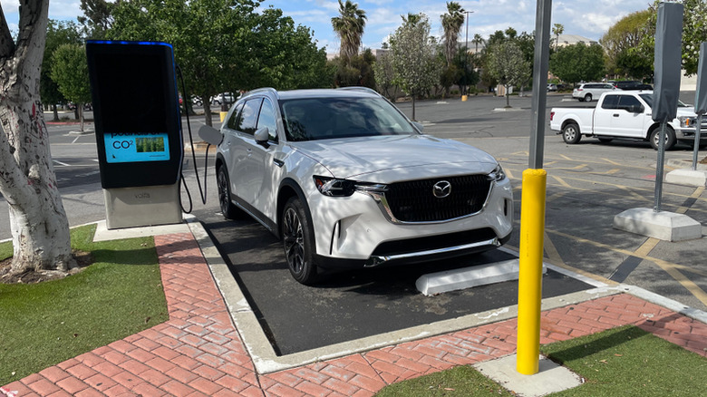 White Mazda CX-90 charging