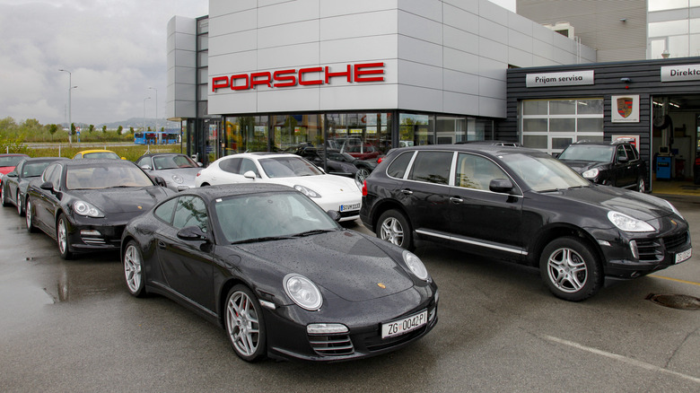 Row of Porsche Panamera models for sale on a lot