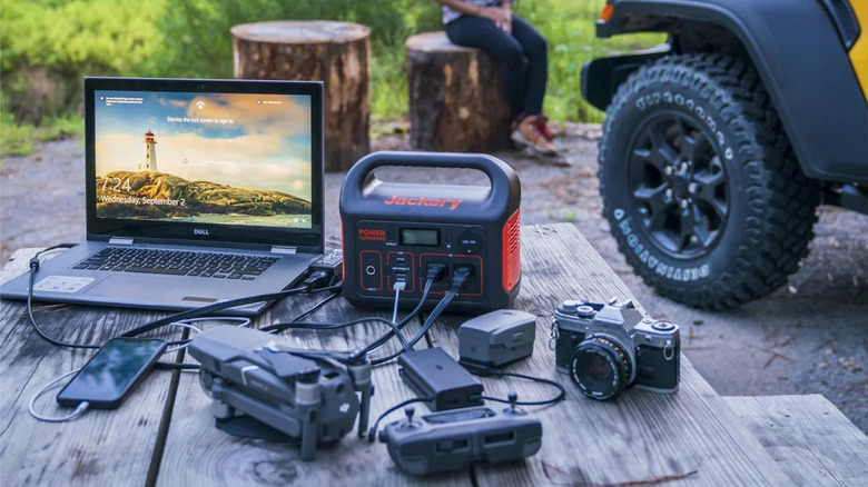 A Jackery Explorer 300 being used in a camping setting.