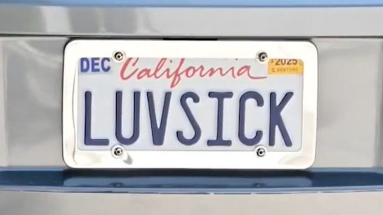 California vanity plate on a Dodge Magnum. The plate reads "LUVSICK."