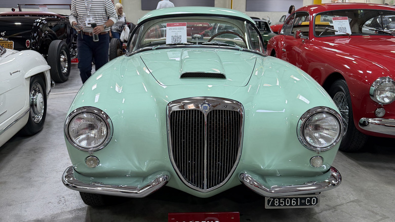 Front end of a green 1955 Lancia Aurelia B24S Spider America
