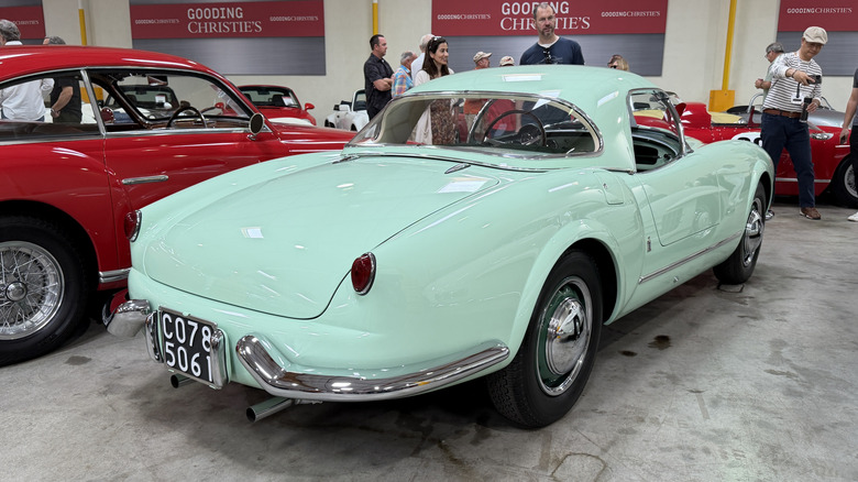 Rear 3/4 view of a green 1955 Lancia Aurelia B24S Spider America