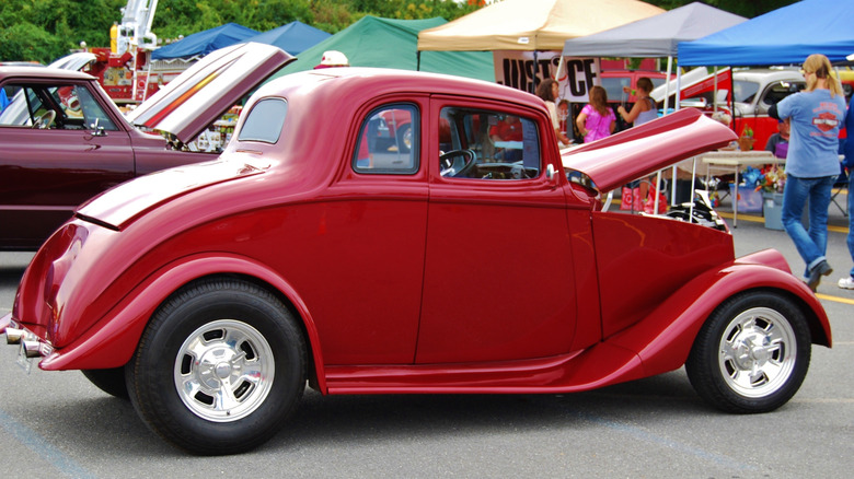 Side shot of a red 1933 Willys 5-window coupe